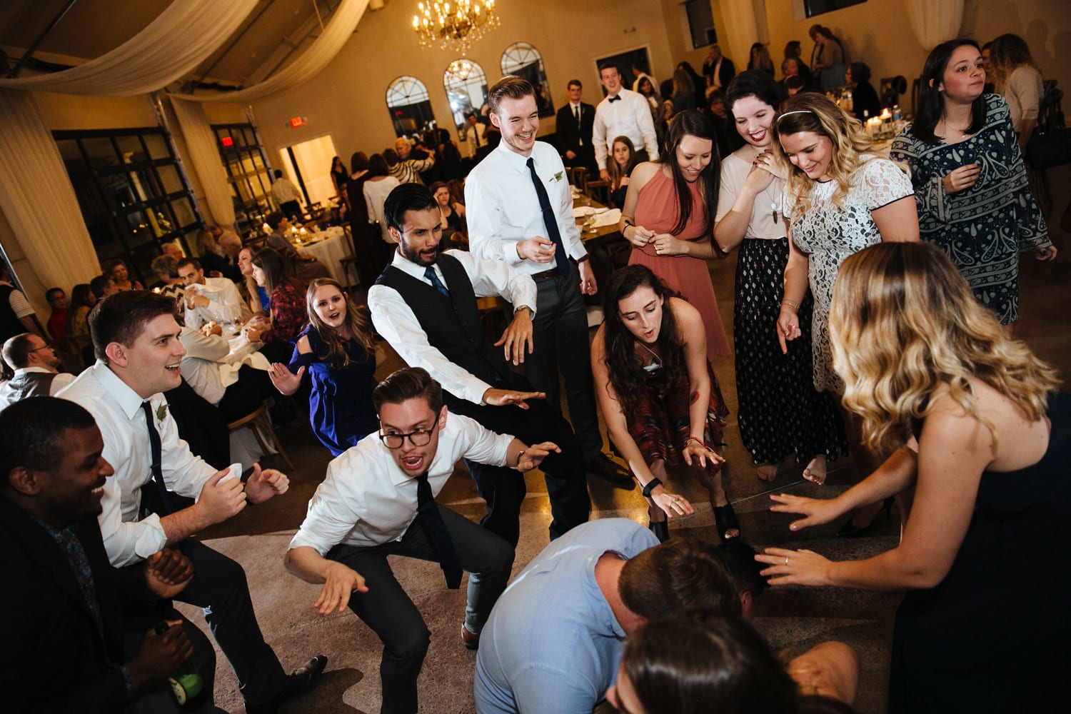 Wedding guests dance on dance floor