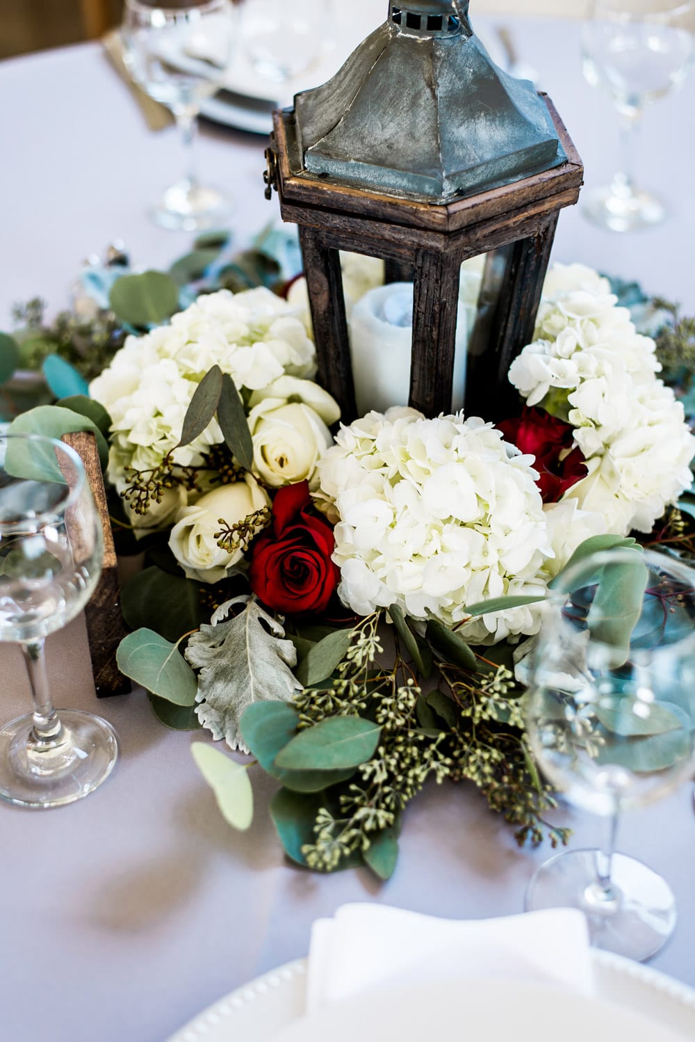 Lantern and florals on dinner table