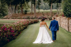 Bride-Groom-walking-September-Wedding-Azaleas